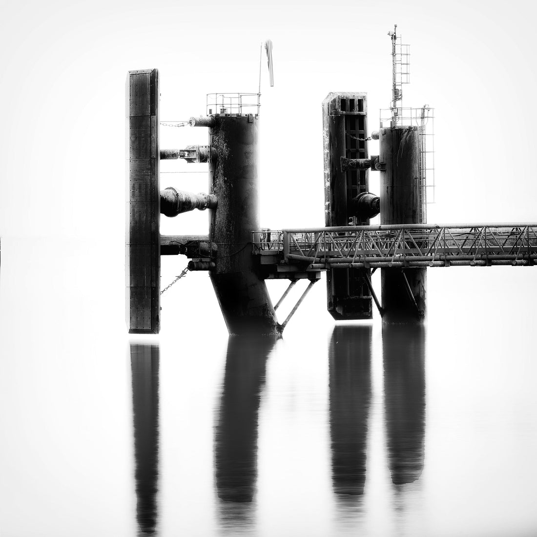 Ferry jetty industrial structure reflected in still water, Dún Laoghaire — Roy Fraser Photography